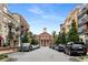 Street view of a town square with parked cars and shops on either side at 5065 Winship Ct, Alpharetta, GA 30009