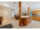 Basement bar with wood cabinetry and countertop providing perfect space for entertaining at 1250 Olympic Dr, Oxford, GA 30054