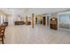 Spacious finished basement area with tiled floors, neutral walls and furniture with access to bedroom at 1250 Olympic Dr, Oxford, GA 30054