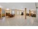 Finished basement showcases an open layout with tile floors, kitchenette, dining area, and relaxing lounge space at 1250 Olympic Dr, Oxford, GA 30054