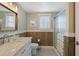 Bathroom featuring a stylish vanity, shower and modern fixtures at 1250 Olympic Dr, Oxford, GA 30054