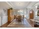Elegant dining room with hardwood floors, large windows, and a chandelier at 1250 Olympic Dr, Oxford, GA 30054