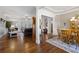 Open floor plan view showcasing hardwood floors, natural light, and view of the adjacent dining area at 1250 Olympic Dr, Oxford, GA 30054