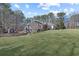 A brick home with well-kept grass and landscaping and a shed in the background at 1250 Olympic Dr, Oxford, GA 30054
