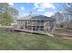 Beautiful home featuring a spacious deck overlooking a well-manicured backyard at 1250 Olympic Dr, Oxford, GA 30054