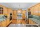 Spacious kitchen with custom wood cabinets, granite countertops, and stainless steel appliances at 1250 Olympic Dr, Oxford, GA 30054
