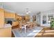 Spacious kitchen with custom wood cabinets, granite countertops, and adjacent dining area at 1250 Olympic Dr, Oxford, GA 30054