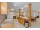 Basement kitchenette offers essential appliances and a breakfast bar for casual dining at 1250 Olympic Dr, Oxford, GA 30054
