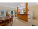 Functional basement kitchenette includes appliances, wood cabinets, and a breakfast bar with seating at 1250 Olympic Dr, Oxford, GA 30054