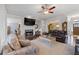 Living room features a fireplace, hardwood floors, and ample lighting at 1250 Olympic Dr, Oxford, GA 30054
