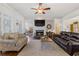 Spacious living room with hardwood floors, a fireplace, and ample seating at 1250 Olympic Dr, Oxford, GA 30054