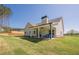 Beautiful backyard with a covered patio and well-maintained lawn perfect for outdoor activities at 30 Pinewood Dr, Covington, GA 30014