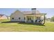 Spacious backyard with a covered patio, ideal for entertaining and relaxation at 30 Pinewood Dr, Covington, GA 30014