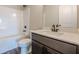 Bathroom featuring dark wood cabinets and an over-sized tub with a shower at 30 Pinewood Dr, Covington, GA 30014