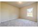 Neutral bedroom with plush carpet and a large window at 30 Pinewood Dr, Covington, GA 30014