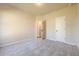 Neutral bedroom with plush carpet and an open doorway at 30 Pinewood Dr, Covington, GA 30014