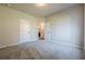 Bedroom with neutral walls and wall-to-wall carpeting and closets and doors at 30 Pinewood Dr, Covington, GA 30014