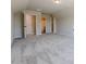 Large carpeted bonus room with view to a bathroom and multiple closet areas at 30 Pinewood Dr, Covington, GA 30014
