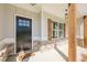 Inviting front porch with rustic wood supports, brick accents, and a charming 'hello' welcome mat at 30 Pinewood Dr, Covington, GA 30014