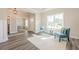 Cozy living room with hardwood floors, flowing to home office, perfect for relaxing at 30 Pinewood Dr, Covington, GA 30014