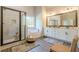 Modern bathroom features a glass enclosed shower, soaking tub, and double sink vanity at 30 Pinewood Dr, Covington, GA 30014