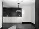 Modern bar featuring white cabinetry, dark backsplash, and elegant lighting at 199 14Th St # 3003, Atlanta, GA 30309