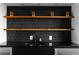 Chic bar area featuring dark backsplash, wooden shelves, and stainless steel mini-fridge at 199 14Th St # 3003, Atlanta, GA 30309
