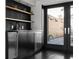 Stylish bar area with wooden shelves and stainless appliances at 199 14Th St # 3003, Atlanta, GA 30309