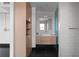 Modern bathroom featuring a wooden vanity with a white countertop and stylish fixtures at 199 14Th St # 3003, Atlanta, GA 30309