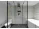 Sleek bathroom featuring a glass-enclosed shower, soaking tub, and modern fixtures at 199 14Th St # 3003, Atlanta, GA 30309