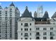 Close-up of The Sterling's architectural details and upper floors featuring balconies and skyline views at 199 14Th St # 3003, Atlanta, GA 30309
