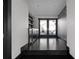 Hallway with dark floors leading to outdoor dining area at 199 14Th St # 3003, Atlanta, GA 30309