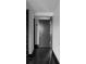 Hallway features sleek black hardwood floors and minimalist aesthetic at 199 14Th St # 3003, Atlanta, GA 30309