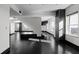 Open living space with dark hardwood floors, white walls, and large windows offering natural light at 199 14Th St # 3003, Atlanta, GA 30309