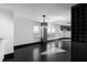 Bright, spacious living room with hardwood floors and modern light fixture at 199 14Th St # 3003, Atlanta, GA 30309