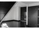 Contemporary living room with an entertainment center, dark hardwood floors, and a modern door at 199 14Th St # 3003, Atlanta, GA 30309
