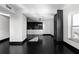 Bright living room with hardwood floors and adjacent modern bar at 199 14Th St # 3003, Atlanta, GA 30309