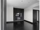 Spacious living room features an entertainment center, dark hardwood floors, and modern decor at 199 14Th St # 3003, Atlanta, GA 30309