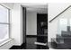 Bright living room with an entertainment center, dark hardwood floors, a staircase and large windows at 199 14Th St # 3003, Atlanta, GA 30309