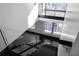 Modern staircase design with large windows providing ample natural light and dark hardwood floors at 199 14Th St # 3003, Atlanta, GA 30309