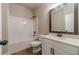 Clean bathroom with white vanity, tub, and mirror at 1892 Alcovy Station Rd, Covington, GA 30014