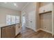 Kitchen features white cabinets and wood-look floors at 1892 Alcovy Station Rd, Covington, GA 30014