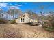 House exterior showcasing a deck and surrounding trees at 61 Macland Springs Dr, Dallas, GA 30157