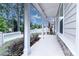 Covered front porch with stone details and view of backyard at 629 Everett Ln, Woodstock, GA 30188