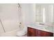 Bathroom showcases a shower-tub combo, vanity with wood cabinets, and ample counter space at 6849 Fireside Ln, Atlanta, GA 30349