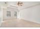 Spacious bedroom with ample natural light and a tray ceiling at 6849 Fireside Ln, Atlanta, GA 30349
