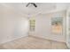 Bedroom features neutral carpet, a ceiling fan, a trey ceiling and natural light at 6849 Fireside Ln, Atlanta, GA 30349
