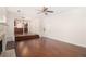 Open-concept living room with hardwood floors, fireplace, and view into the kitchen at 6849 Fireside Ln, Atlanta, GA 30349