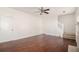 Spacious living room featuring hardwood floors, a ceiling fan, and neutral paint at 6849 Fireside Ln, Atlanta, GA 30349