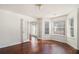 Inviting living room featuring hardwood floors, French doors, and ample natural light at 6849 Fireside Ln, Atlanta, GA 30349